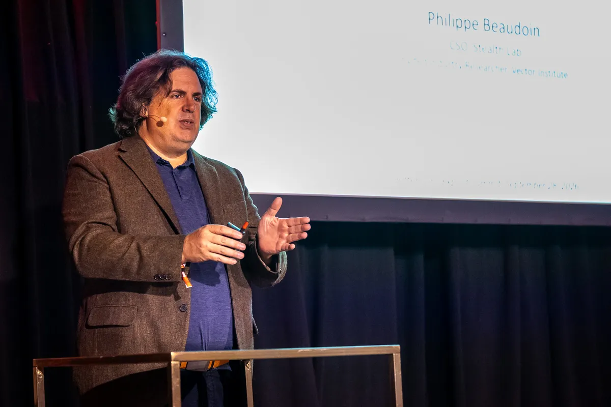 Philippe Beaudoin on a stage at the Bittensor Exploit Conference 2026 at New City Gas.